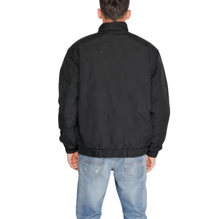 Sleek black Tommy Hilfiger jacket, ideal for Fall/Winter wear.