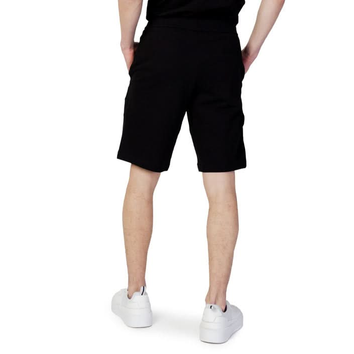 Sleek black plain shorts by Armani Exchange for men, featuring a slip-on fastening and side pockets, crafted from 100% cotton for Spring/Summer wear.