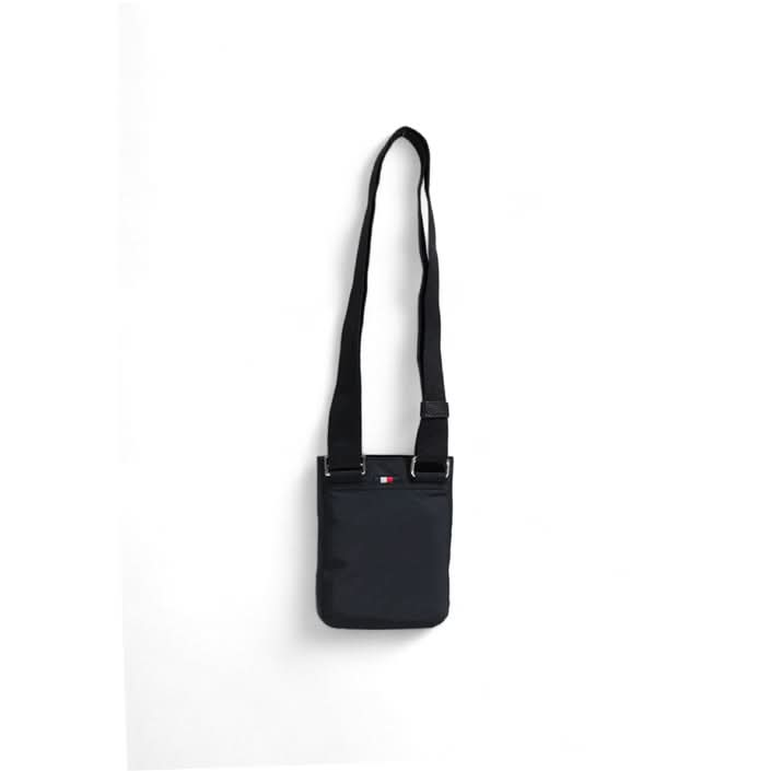 Sleek and durable black Tommy Hilfiger Zip Bag, ideal for Fall/Winter use.