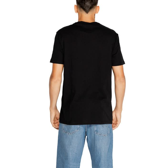 Men’s black T-shirt by Armani Exchange, perfect for layering or casual wear in fall and winter, crafted from 100% cotton for maximum comfort.