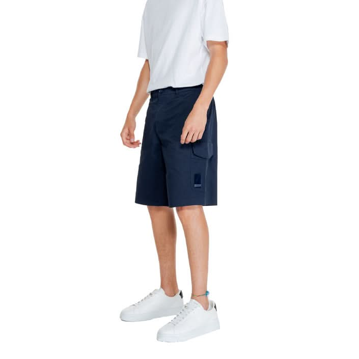 Side view of Armani Exchange blue plain shorts showing the zip and button fastening and multiple pockets, ideal for beachside fun