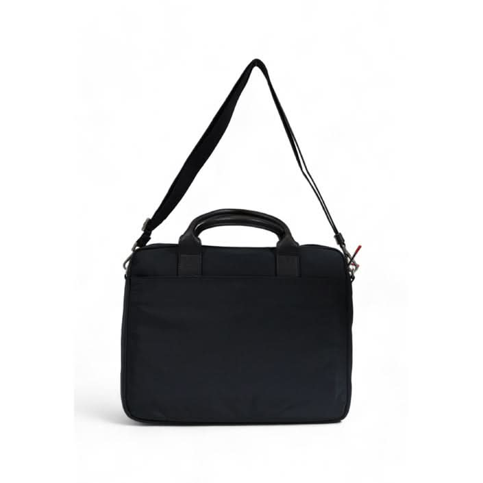 Sleek black Tommy Hilfiger Handbag with a plain pattern, perfect for Fall/Winter.