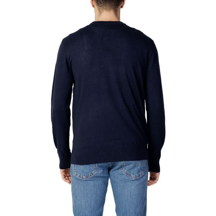 Armani Exchange Fall/Winter blue knitwear – soft blend of cotton, silk, and viscose with a round neck and long sleeves.