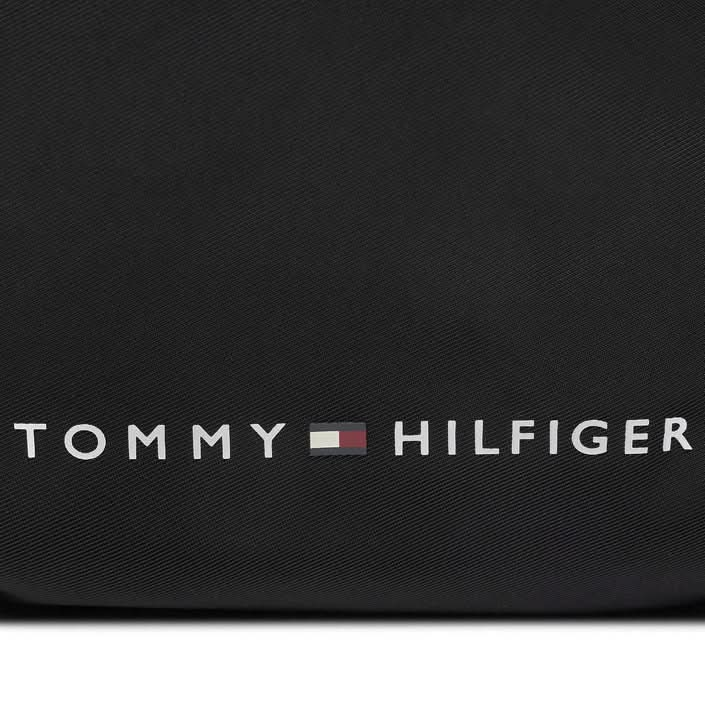 Compact black Tommy Hilfiger printed bag, perfect for Spring/Summer use.
