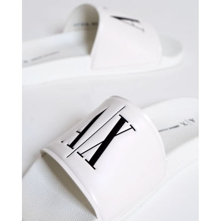 Armani Exchange white slippers – a blend of style and comfort for the Spring/Summer season.