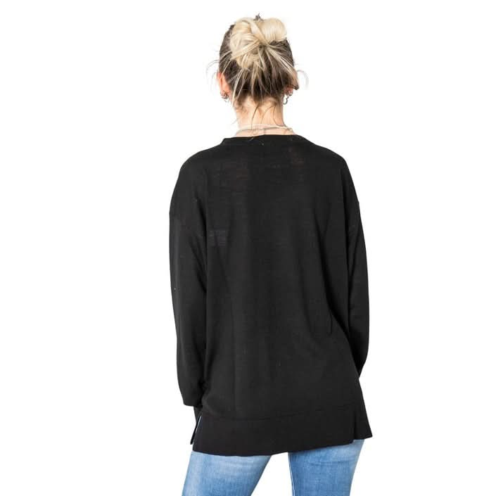 Discover this Armani Exchange Women’s Black Sweater for Winter 2024. Knitted to chic perfection with a stylish print, round neckline, and long sleeves in 100% wool. Perfect for women of all ages. Available at Poshbro."