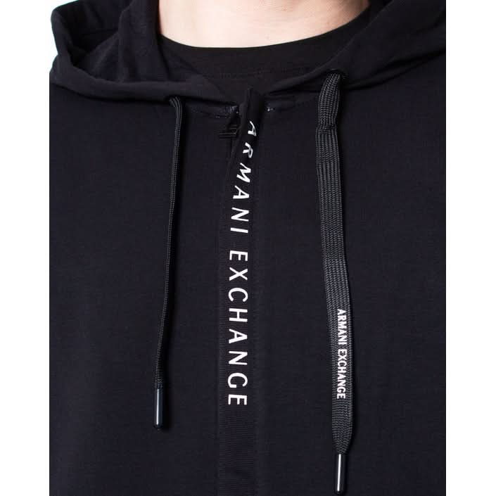 Sleek black hoodie by Armani Exchange for men, featuring a plain design with front pockets and zip fastening for a cool, casual vibe.