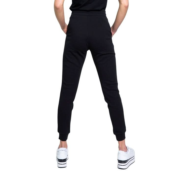 Embrace modern sophistication with these Armani Exchange black trousers. With a playful print and front pockets, these trousers are made from soft cotton and feature a stylish lace-up detail. Ideal for adding a touch of luxury to your Spring/Summer wardrobe."