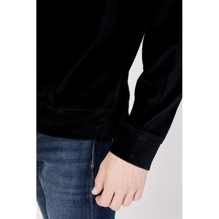 The Armani Exchange men's black sweatshirt, featuring a simple design and premium cotton-polyester blend."